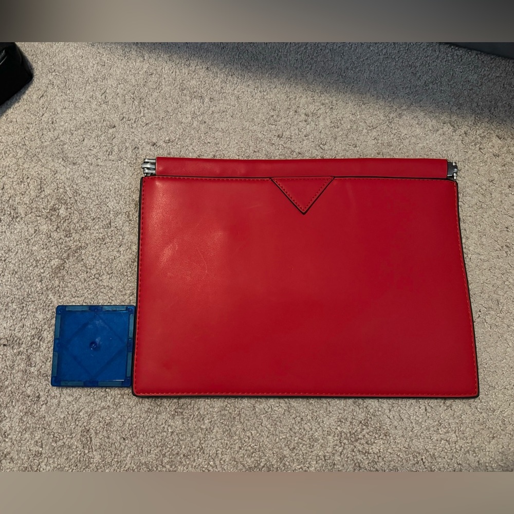 Red clutch - made by Trafaluc sold by Zara.